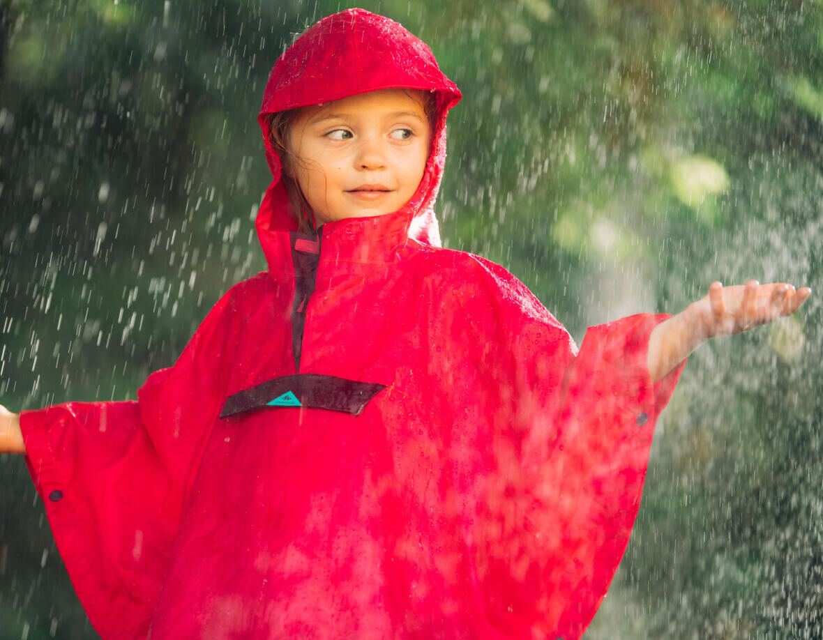 young child wearing a rain poncho