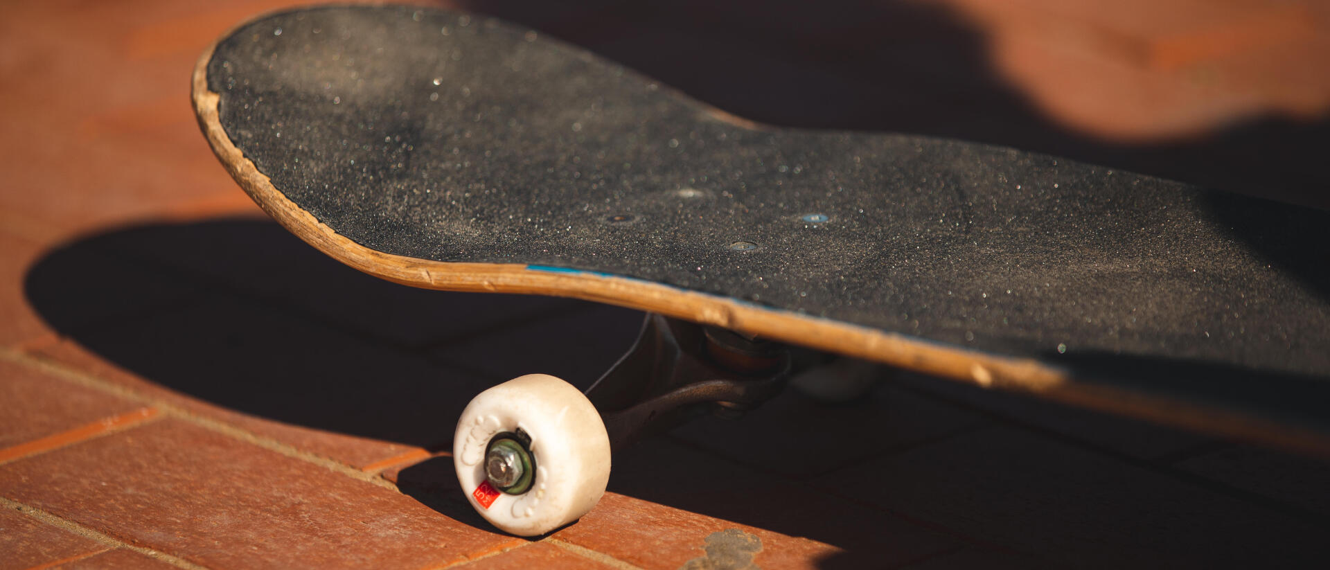 How do you clean and replace a skateboard grip?
