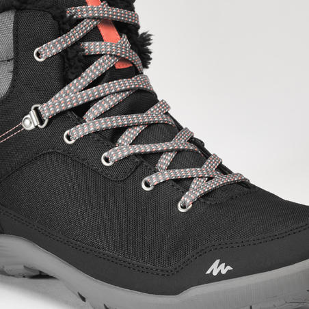 Čizme za planinarenje SH100 srednje duboke tople i vodootporne ženske - crne