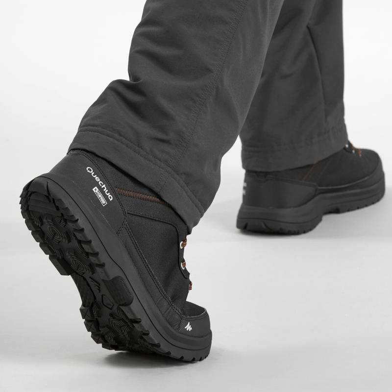รองเท้าหุ้มข้อผู้ชายสำหรับเดินท่ามกลางหิมะที่มีคุณสมบัติกันหนาวและกันน้ำรุ่น SH100 WARM (สีดำ)