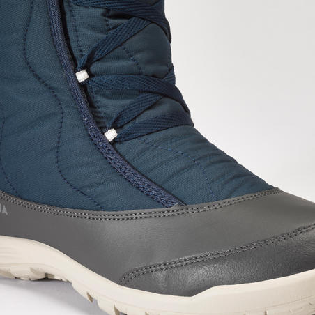 נעליים גבוהות מחממות במיוחד עם שרוכים לנשים דגם SH500 לטיולים בשלג - כחול