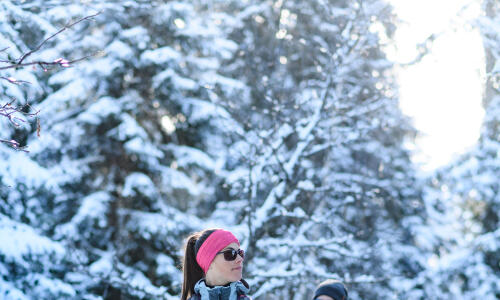 Woman snowshoeing in the forest