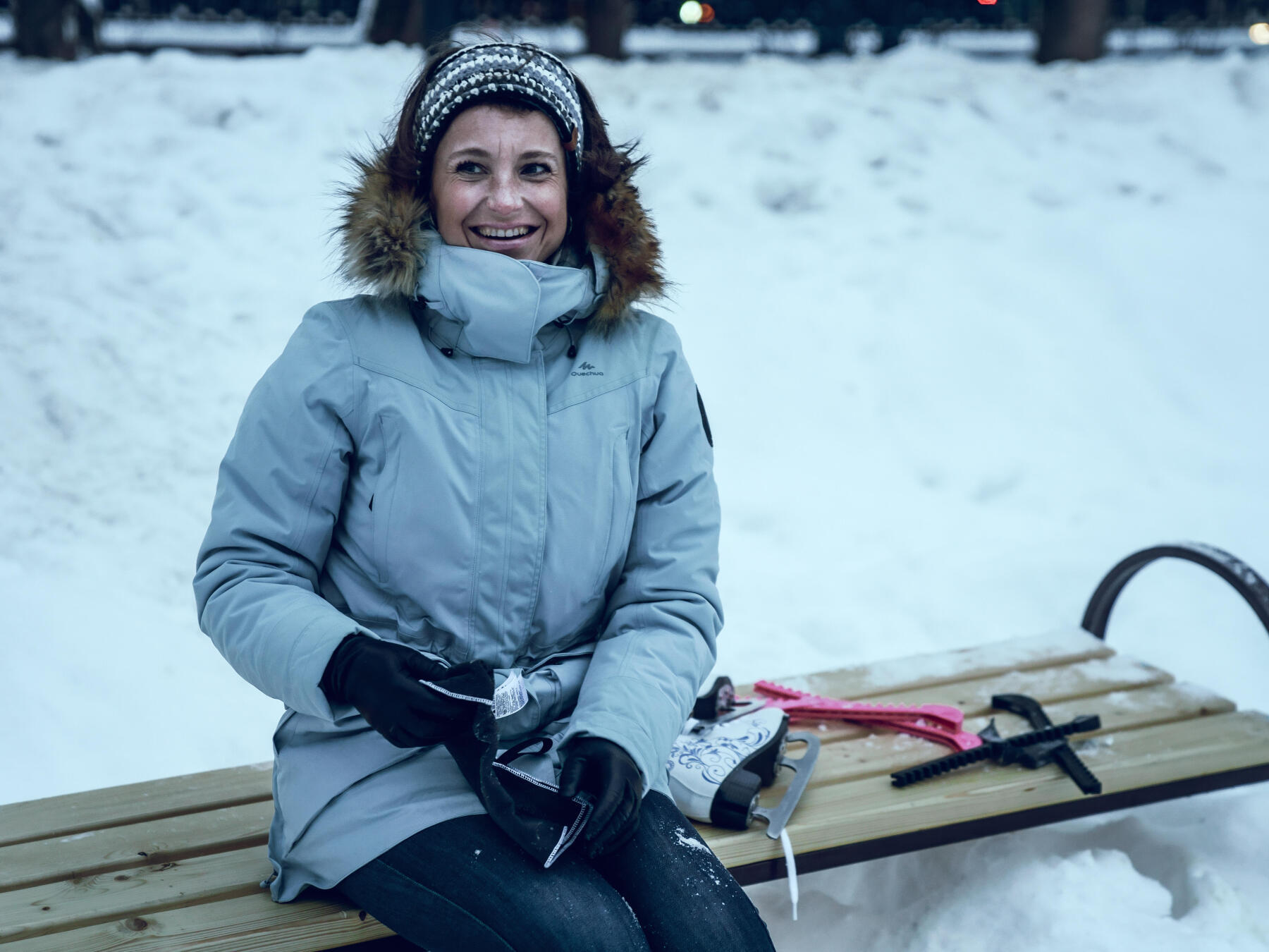 lady taking a skating break on the bench