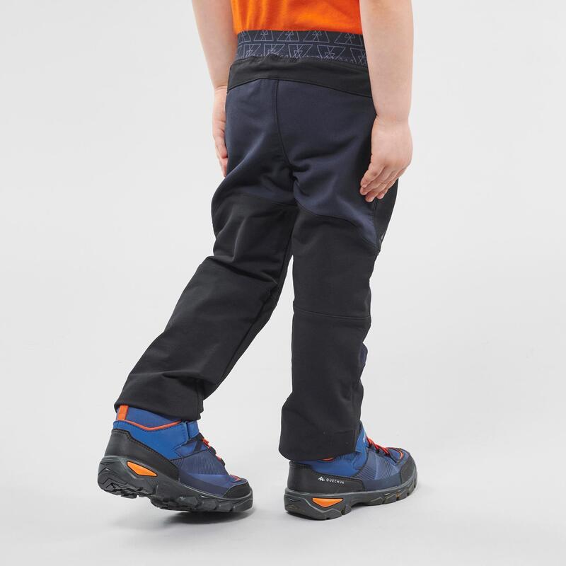 Softshell broek voor wandelen kinderen MH550 zwart 2-6 jaar