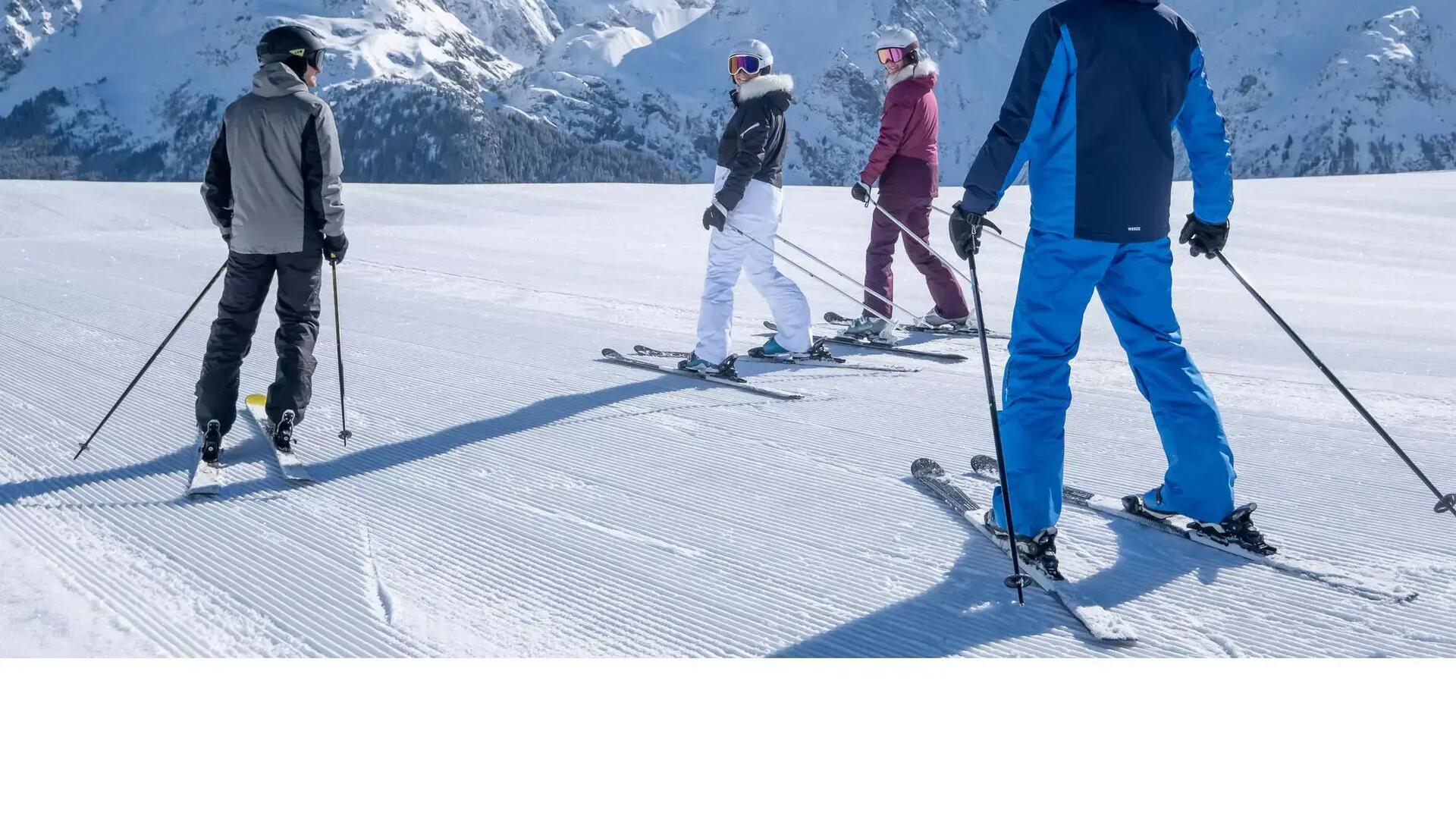 A group of adult skiers on their Wedze skis on a fresh ski slope