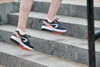 Кроссовки для бега женские с принтом черно-оранжевые RUN ACTIVE GRIP Kalenji