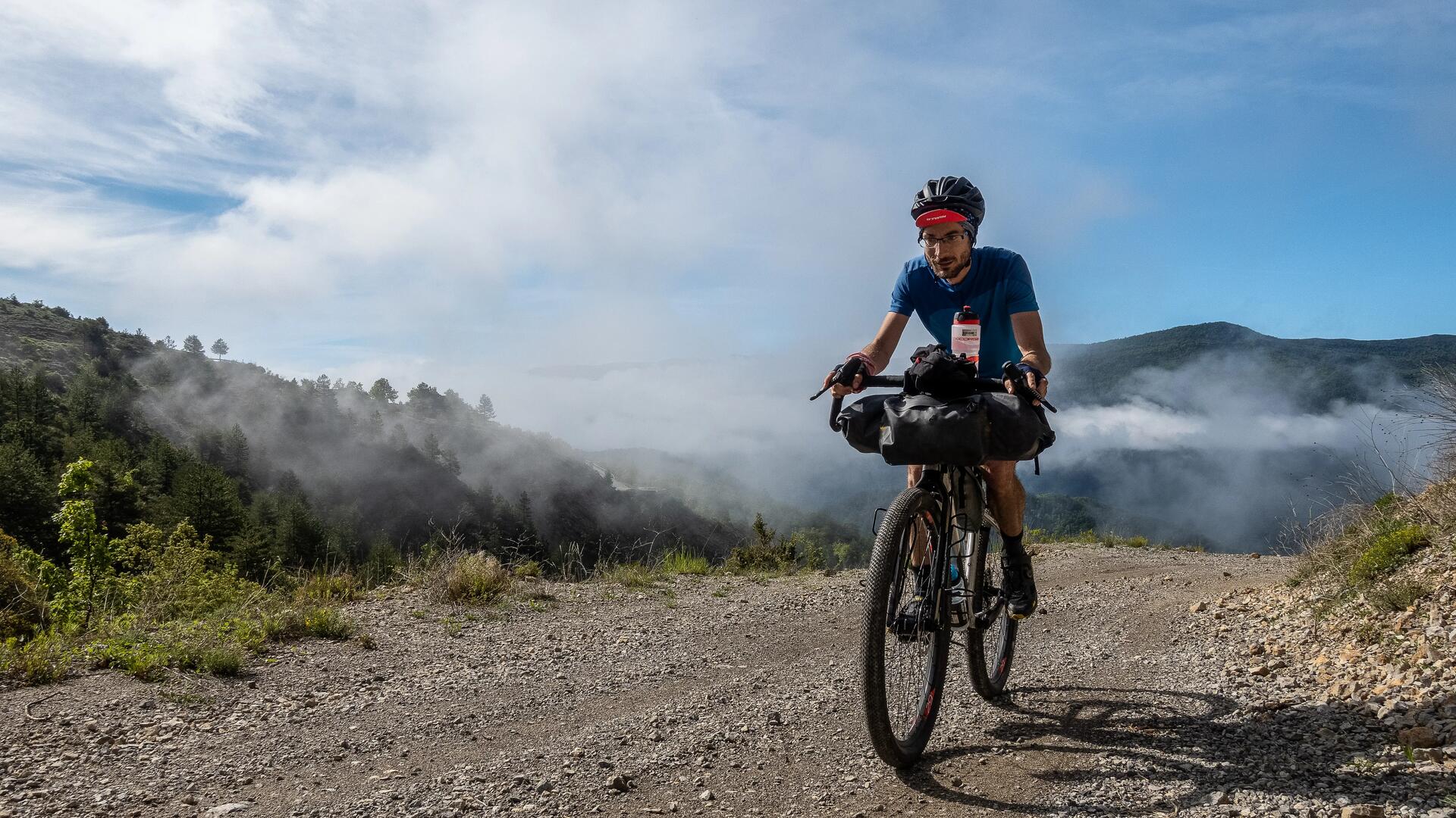 cyclist on the road in an unbelievable landscape 