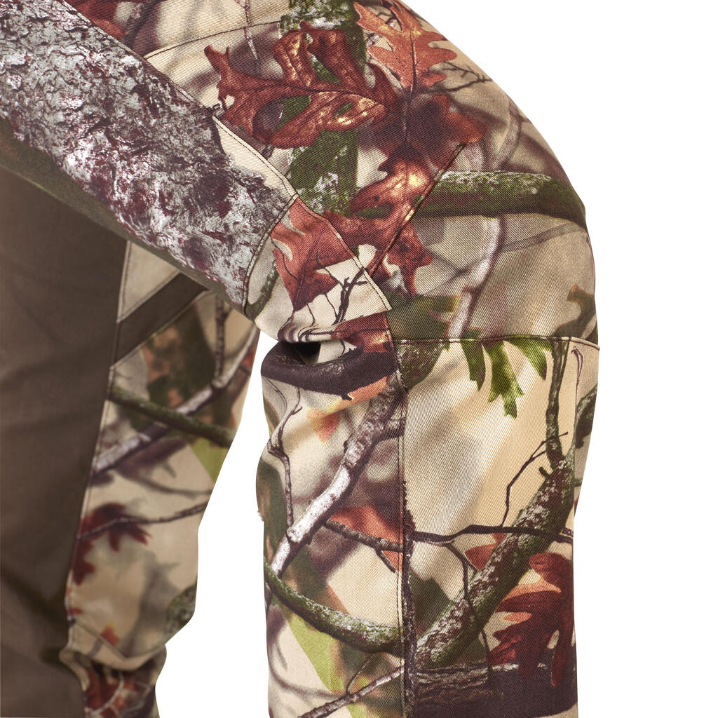 Dámske poľovnícke nohavice 500 nehlučné s maskovacím motívom lesa