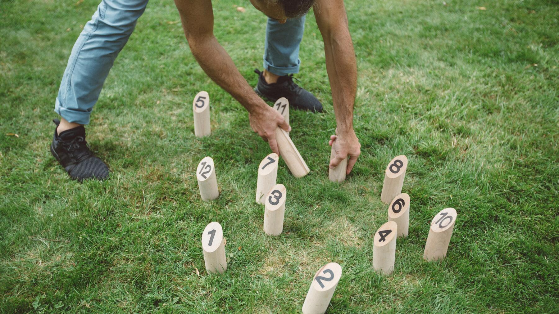 Player showing how to stand the pins back up