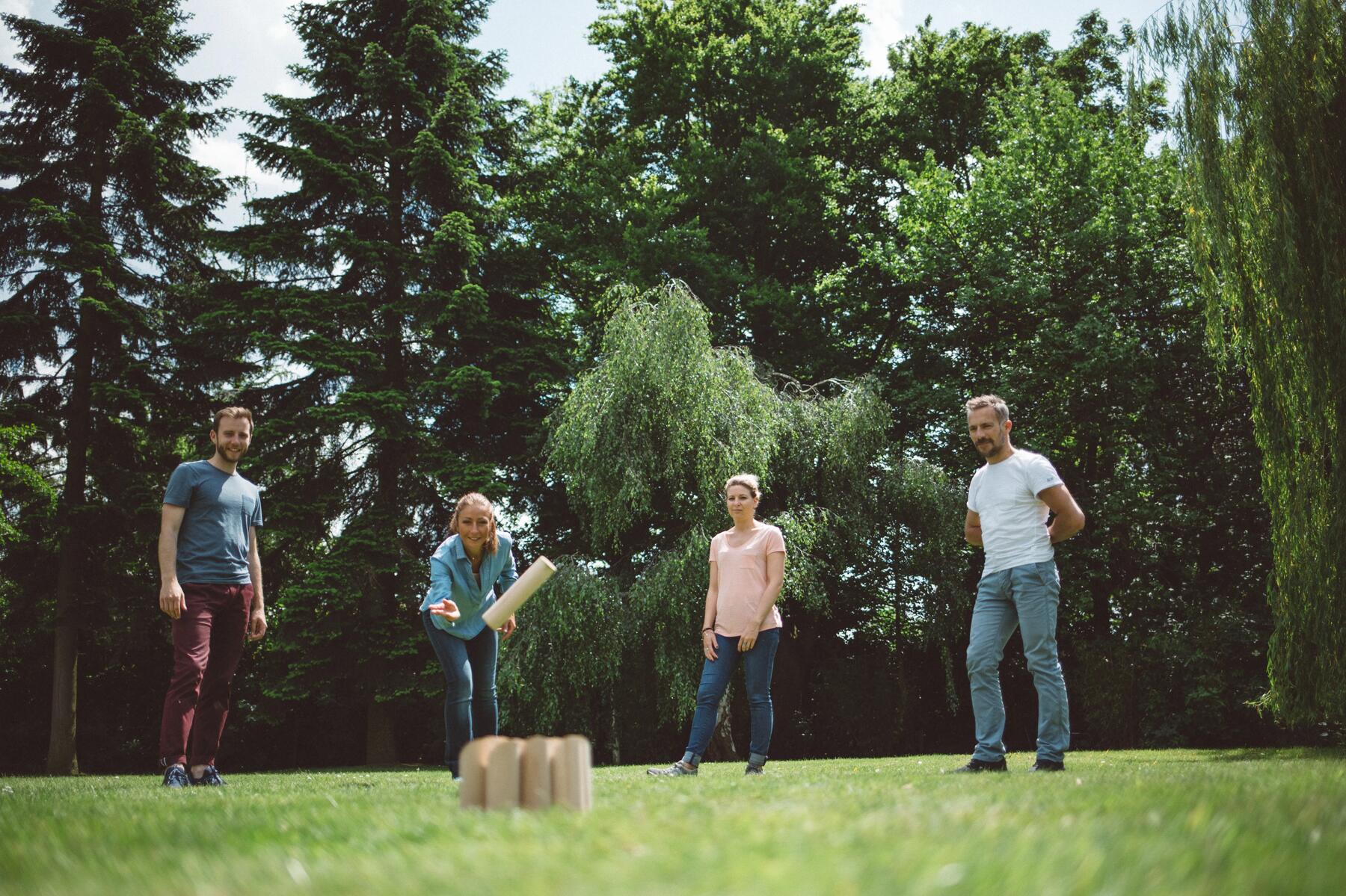 A little boy playing finnish skittles, the game that improves your mental math