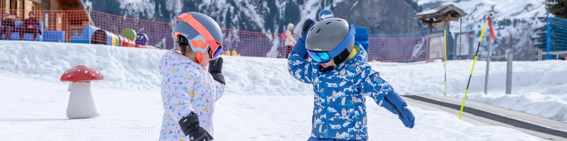 2 kids preparing for a ski session