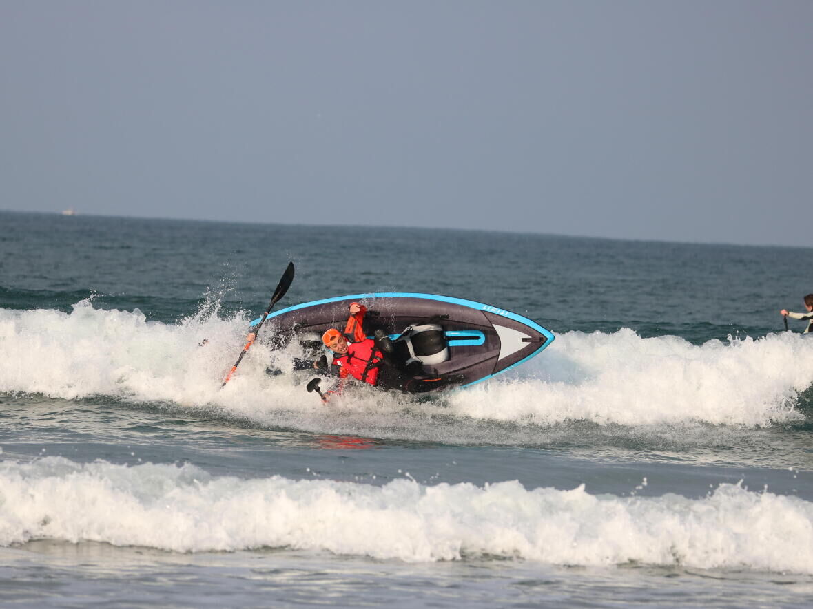 wave sea kayak surfing