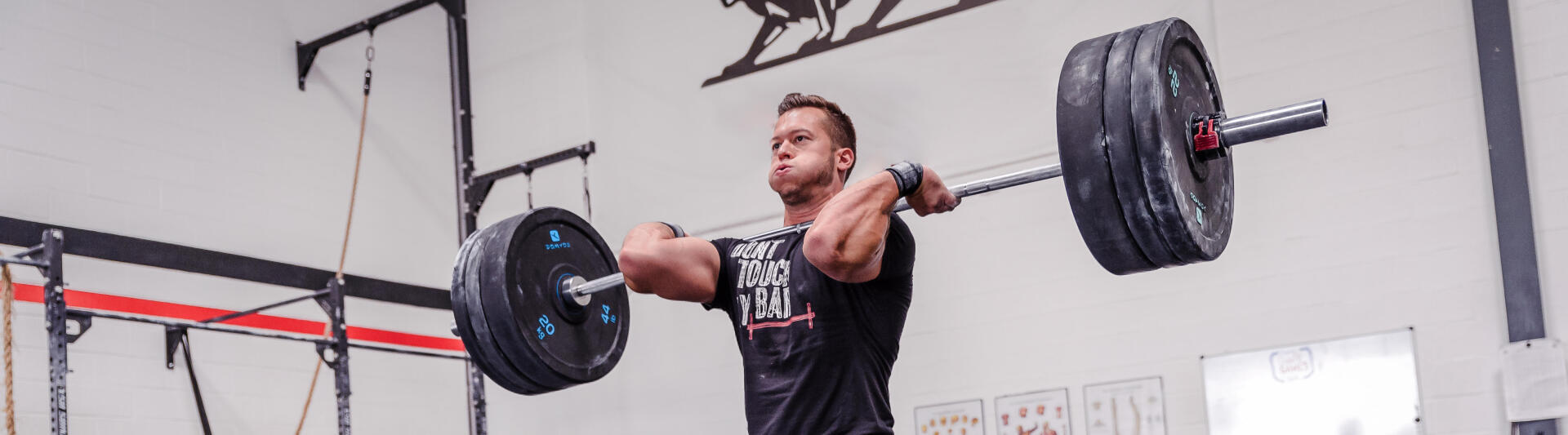 man lifting weights in a gym