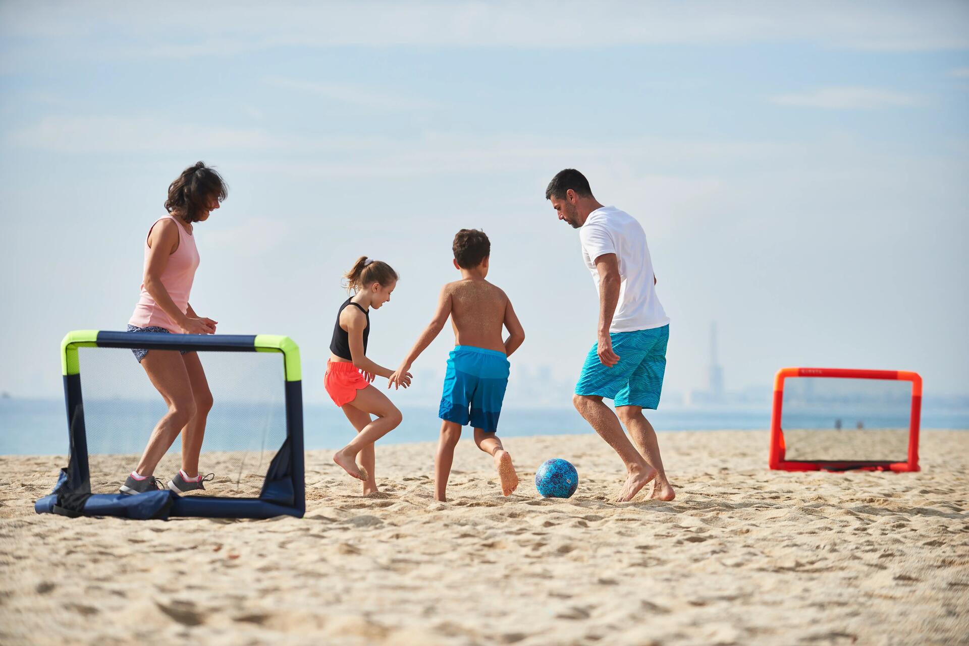 young girl playing on the beach