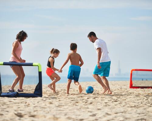 young girl playing on the beach