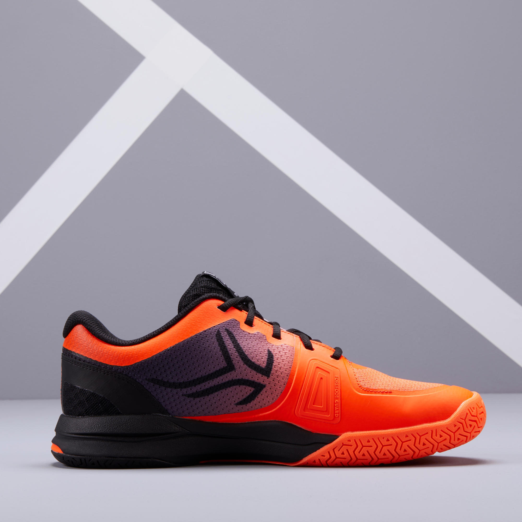 orange and black tennis shoes