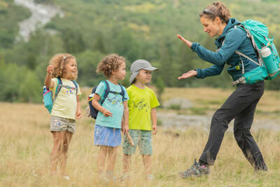 Kids and a woman do hiking