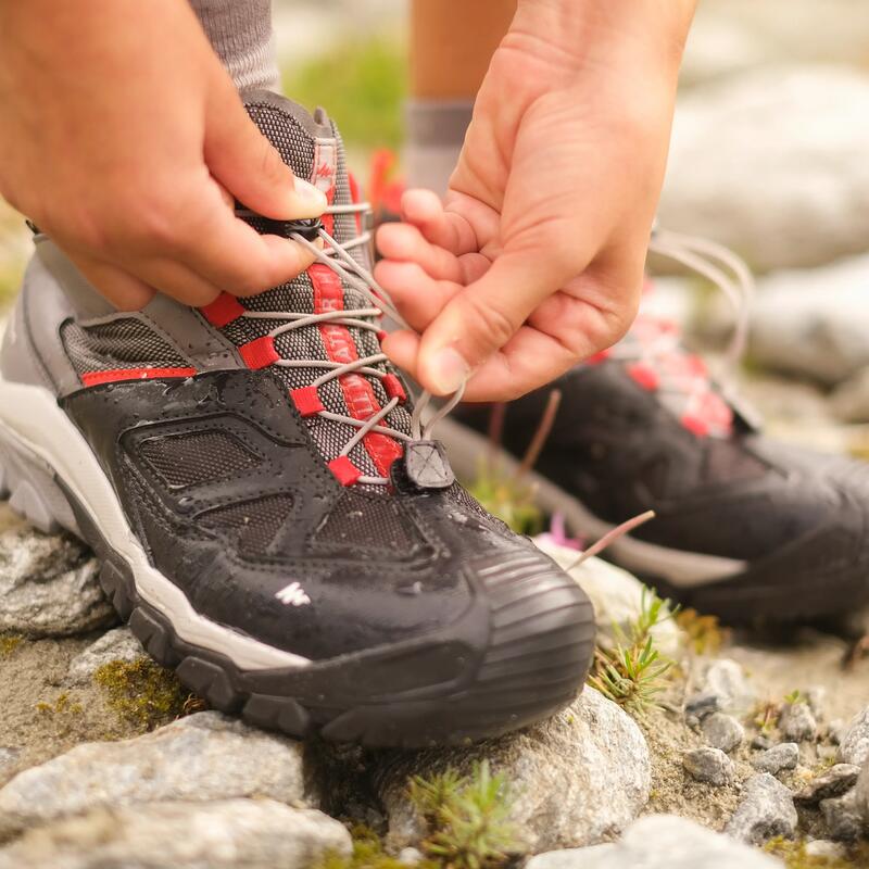 How do I correctly fasten and tie up my hiking shoes?