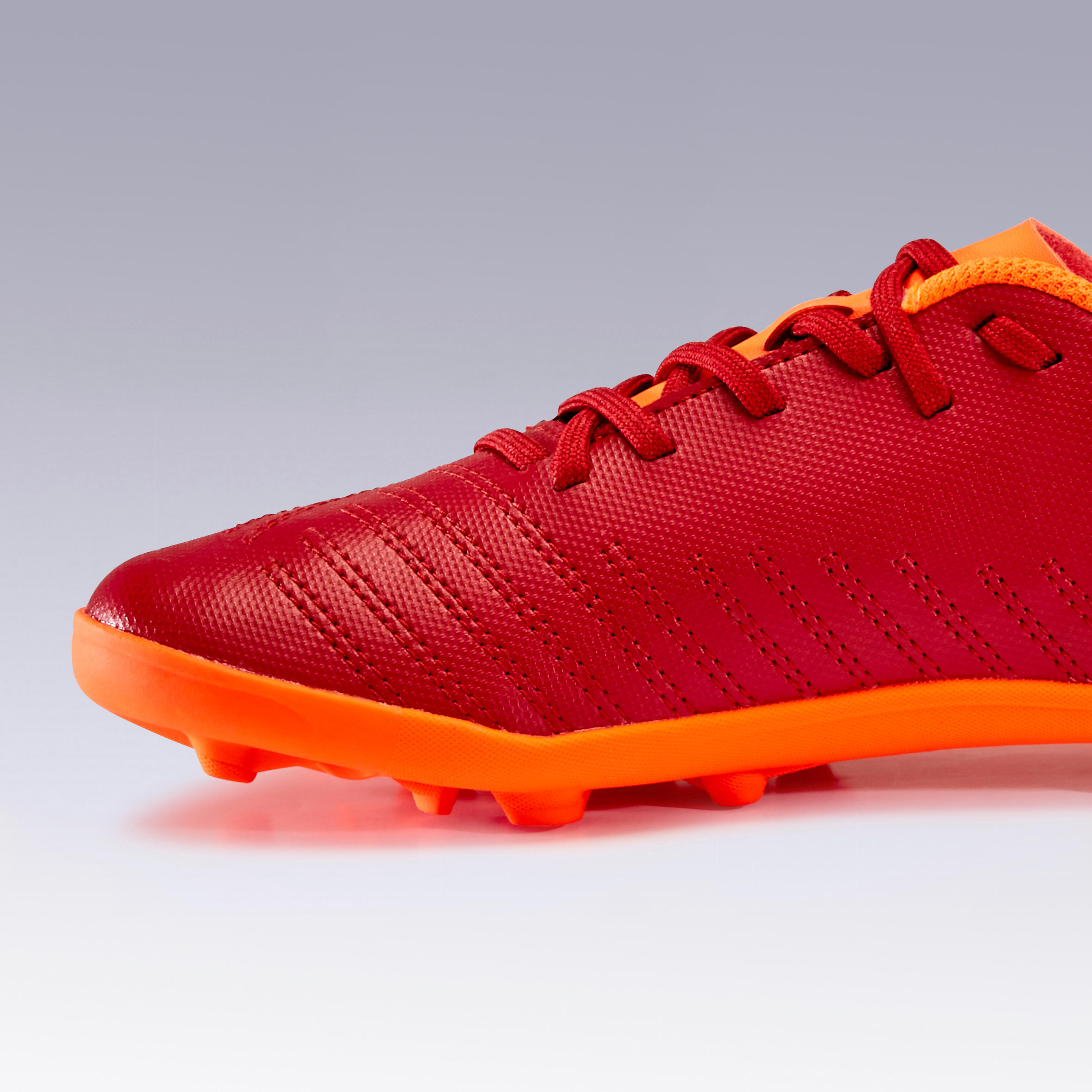 kids orange football cleats