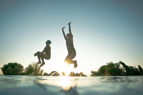Picture of kids jumping to a pool