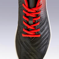 Chaussure de football terrain sec Agility 100 FG noire rouge