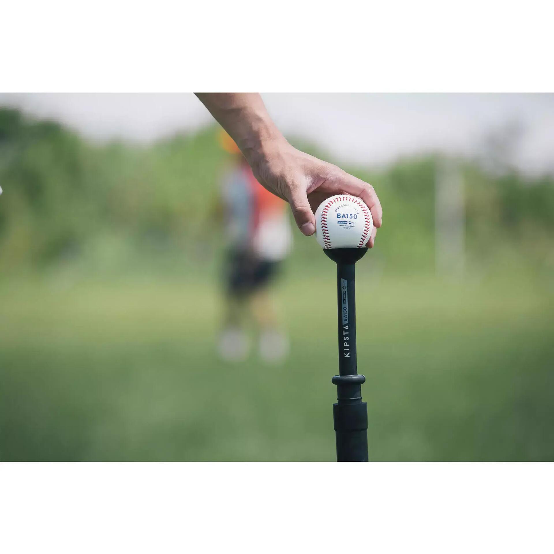 placing a ball on a batting tee
