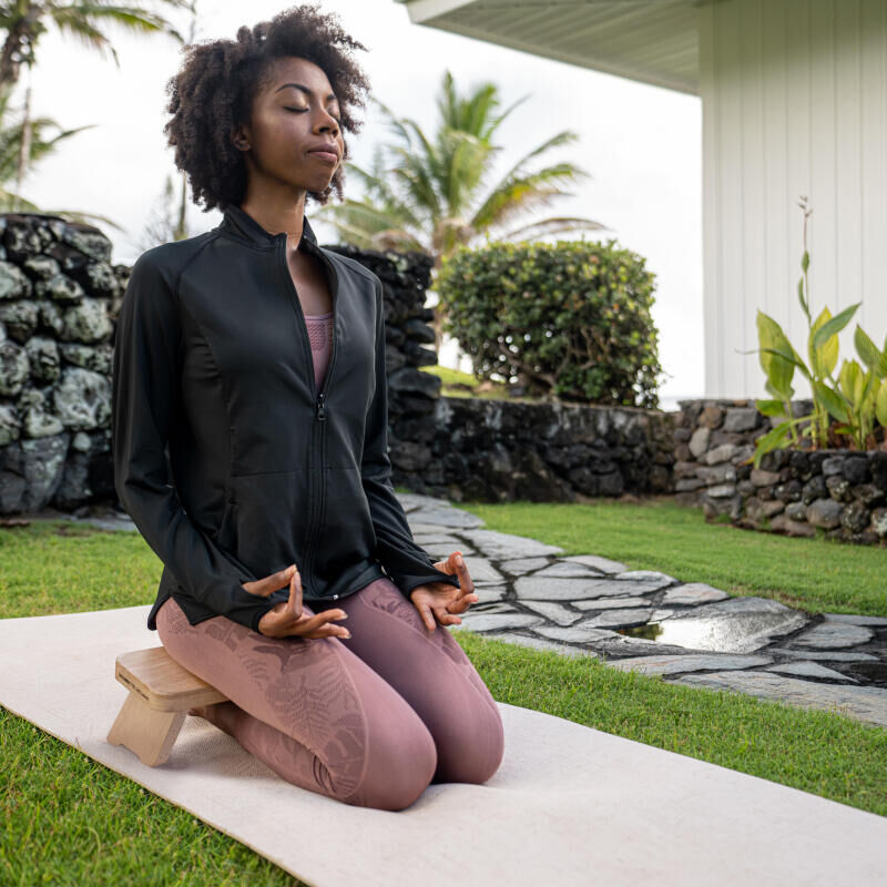 Woman meditating outside