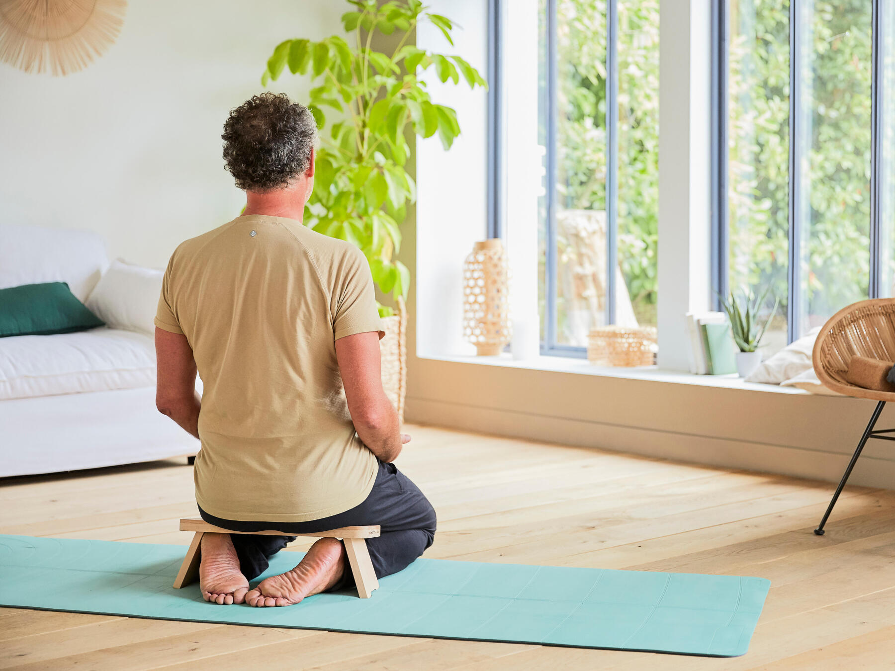 man meditating indoors