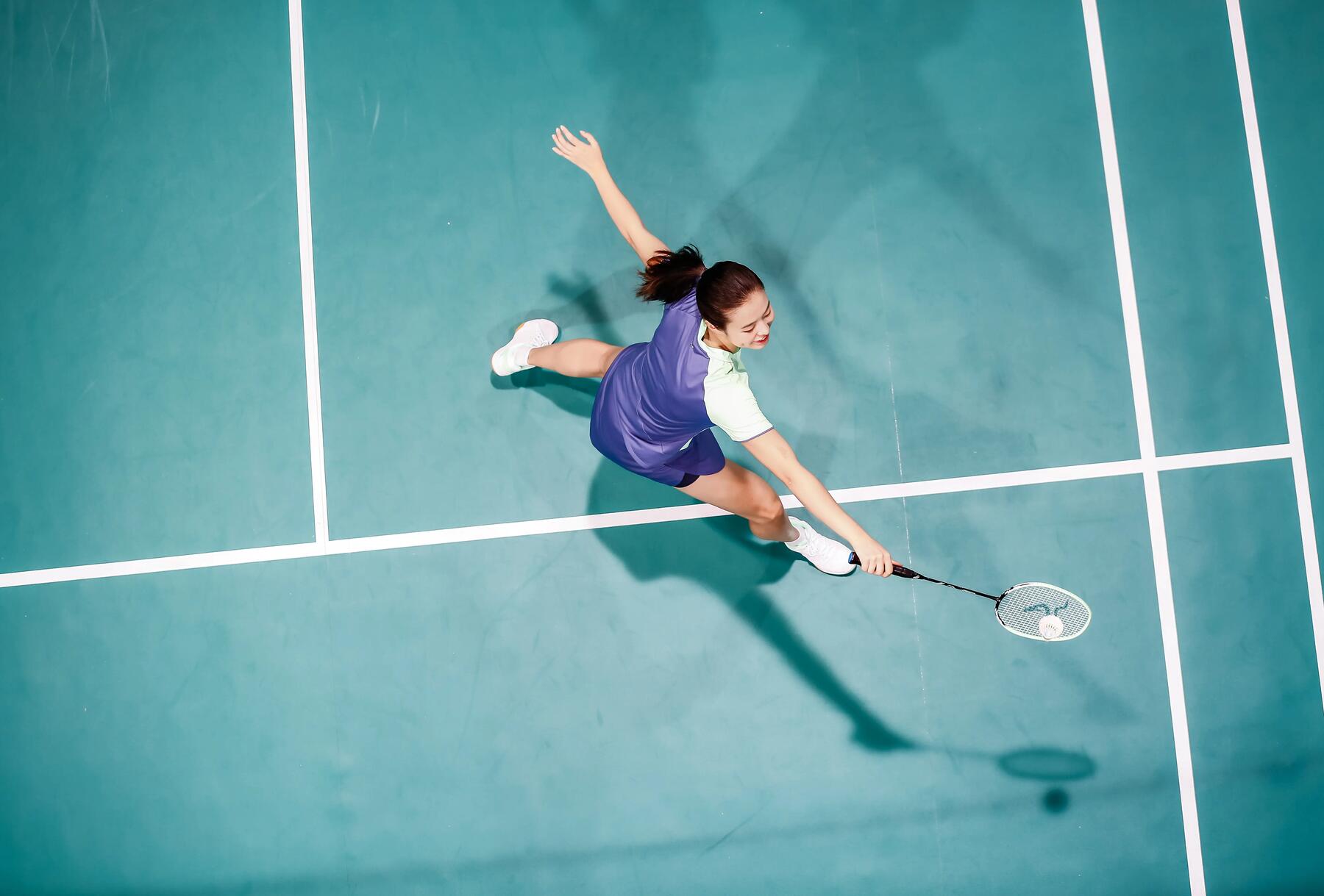 High angle shot of a badminton player playing on a court