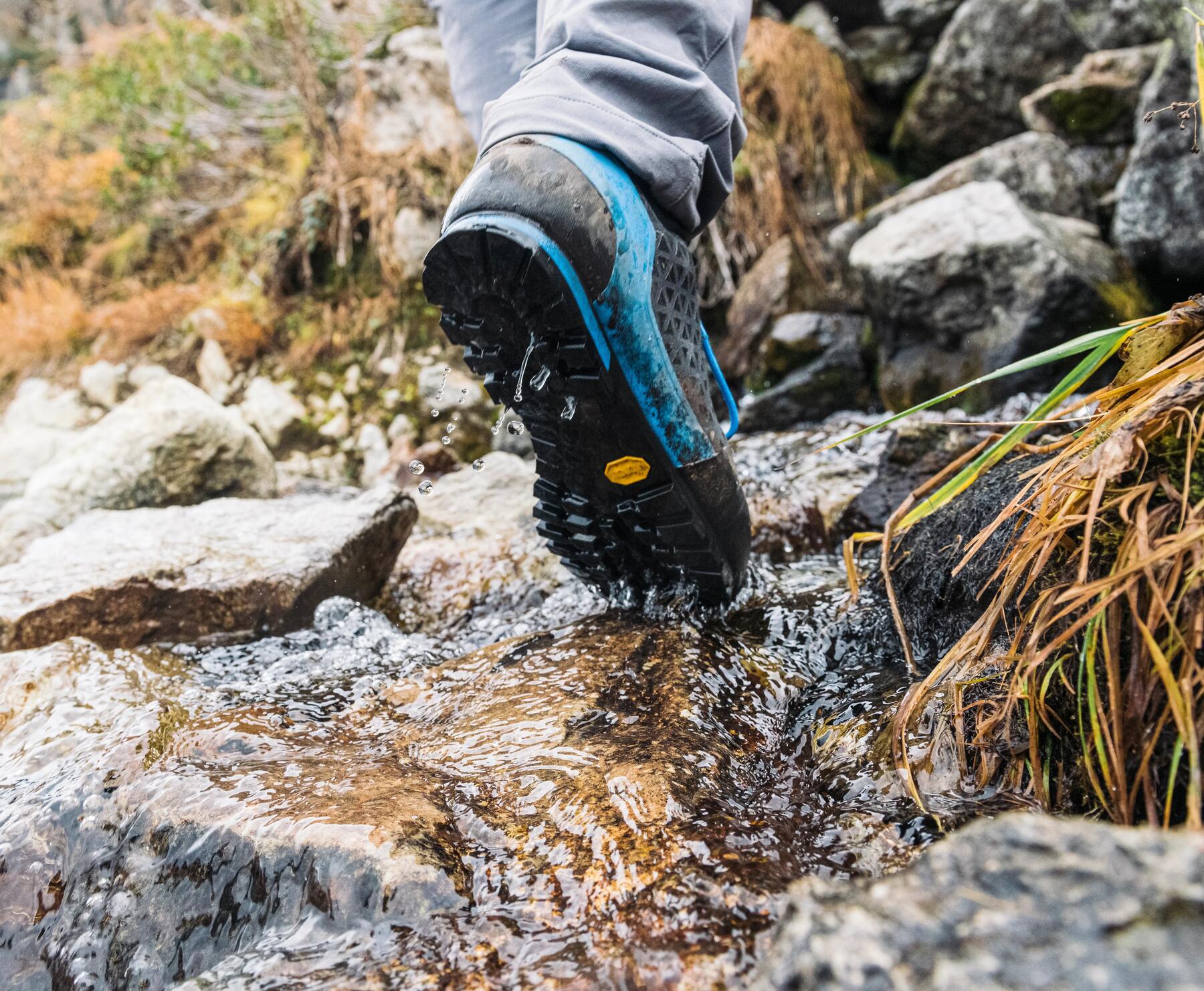 Close up of a person's foot hiking on top of rocks