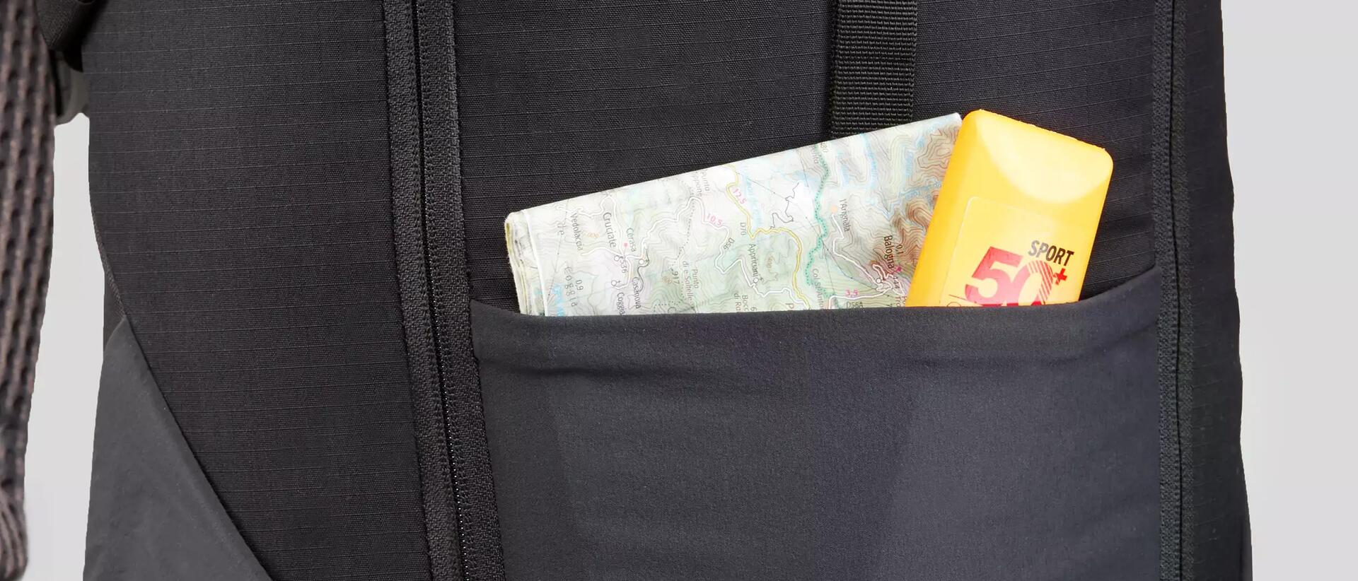 Sun cream and map inside a rucksack's pocket