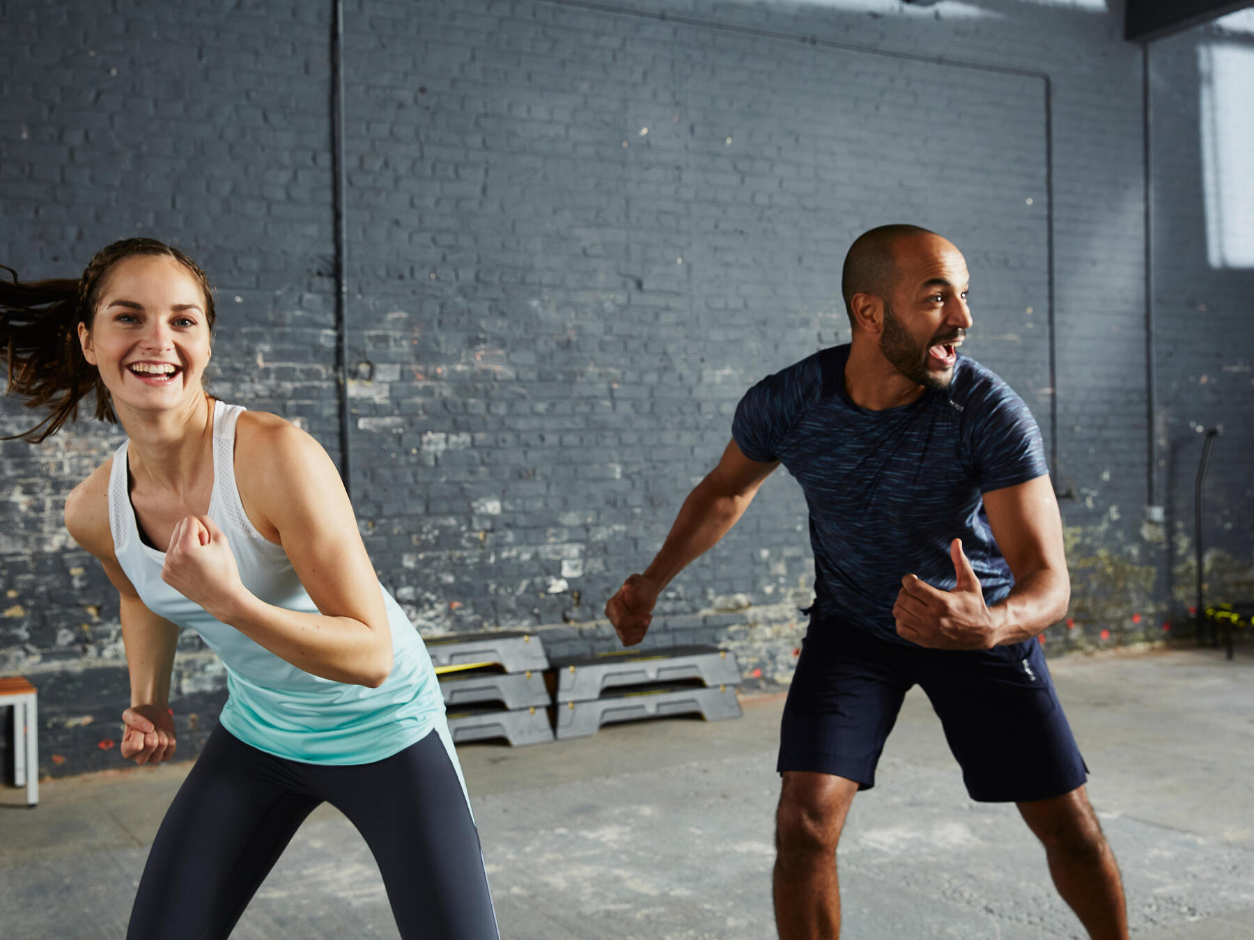 woman and man having fun working out