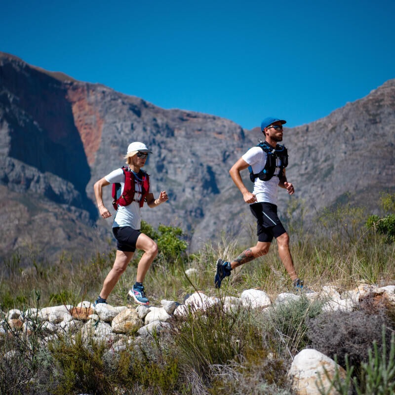 a man and a woman running in hot weather on the mountain