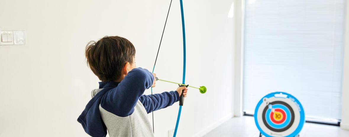 young boy playing with a Softarchery kit