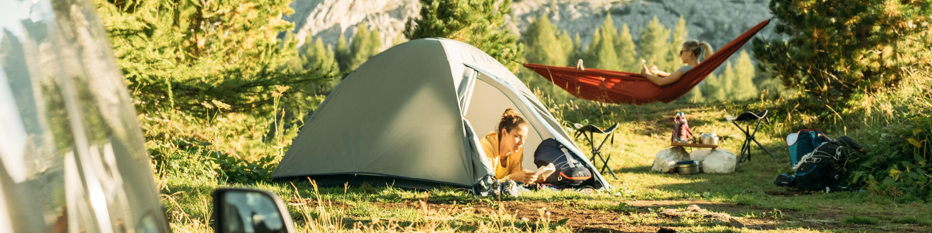 2 women camping and enjoying the quiet of nature