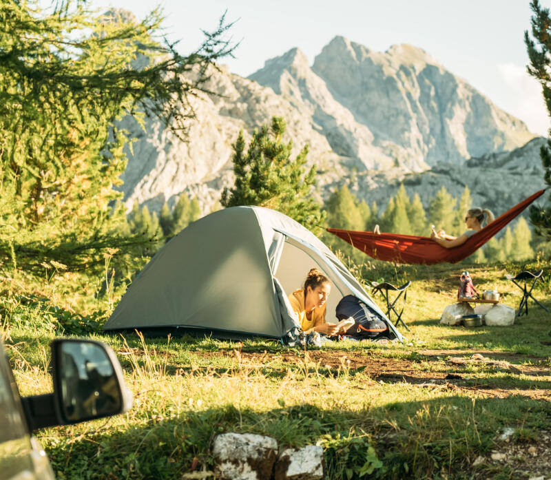 2 women camping and enjoying the quiet of nature