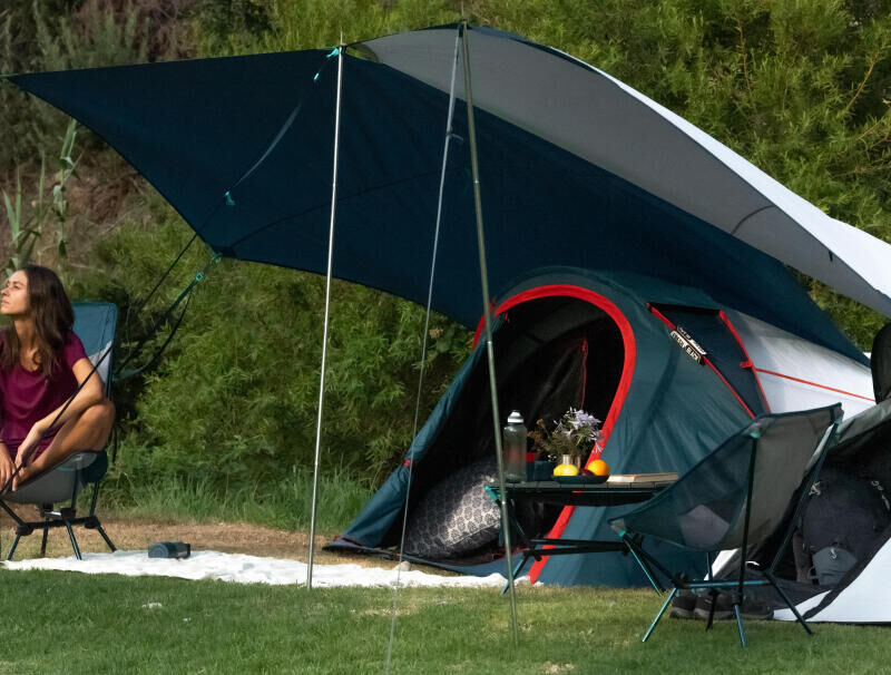 woman in front of the 2-second tent