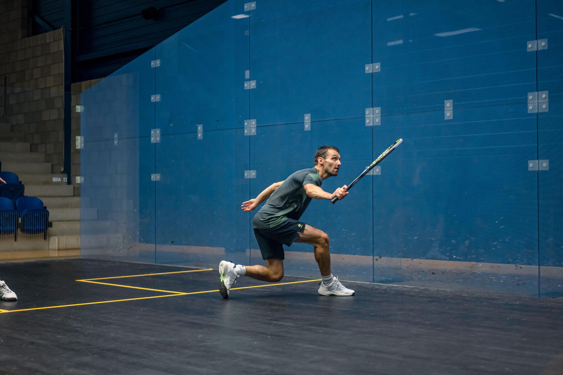 A shot of a person playing squash