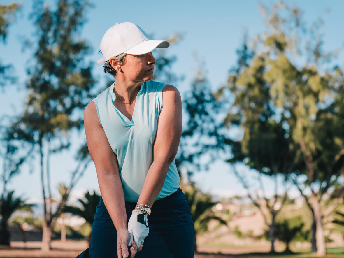 woman ready to hit her golf ball on the tee off