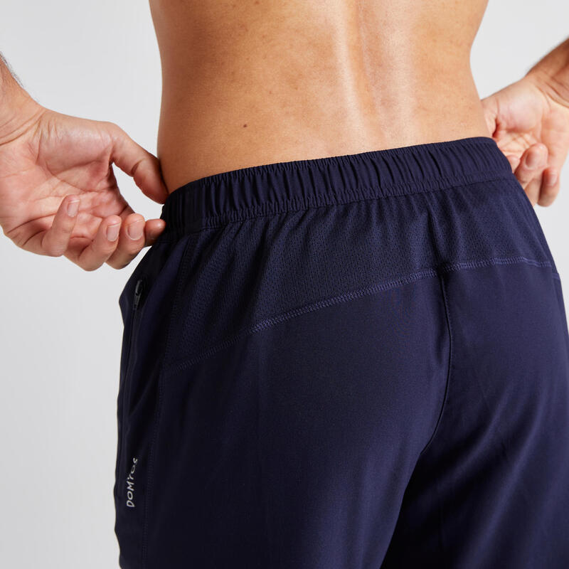 Pantaloni uomo fitness essential 120 tasche con zip blu