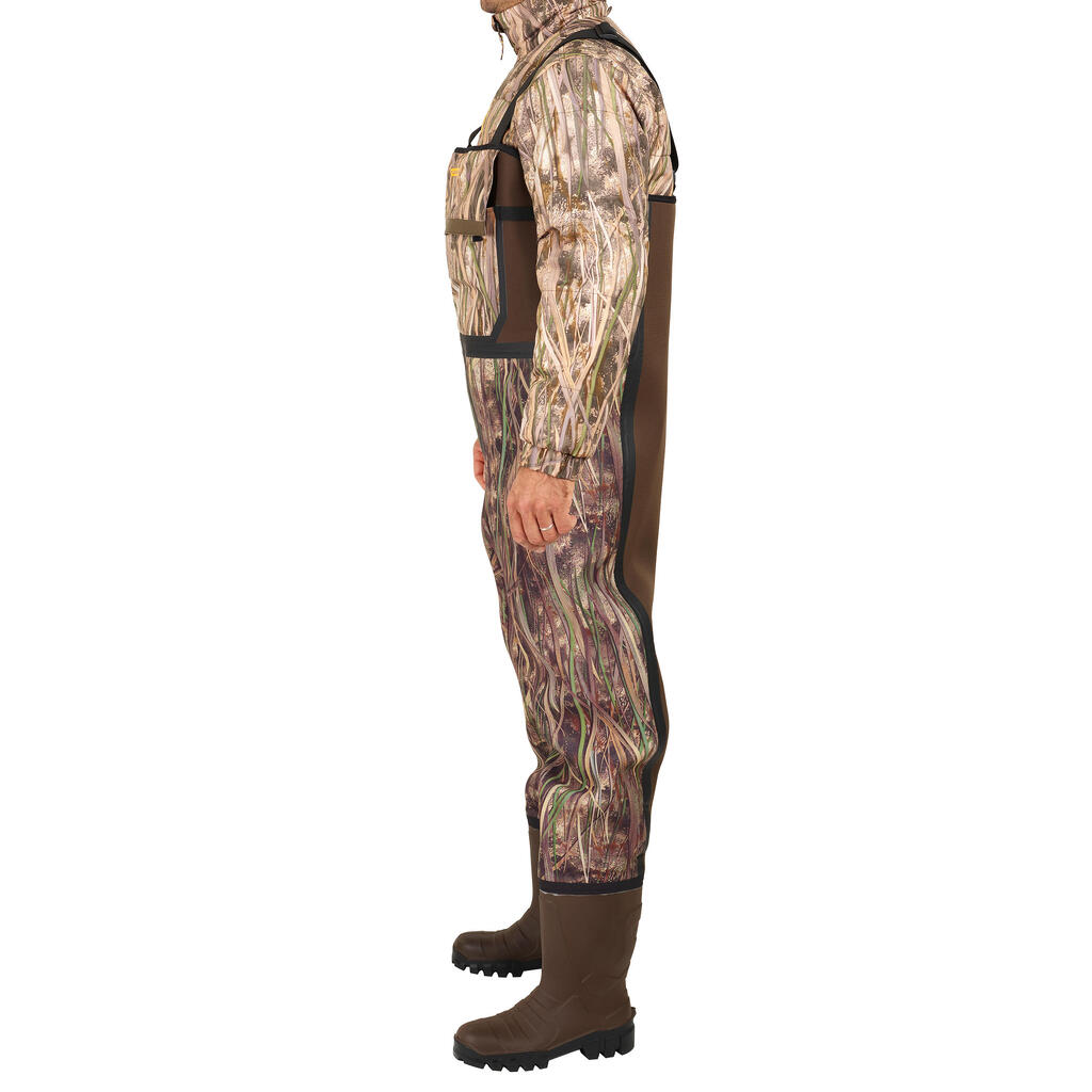 Poľovnícke brodiace neoprénové nohavice 500 hrejivé maskovanie s motívom močiara