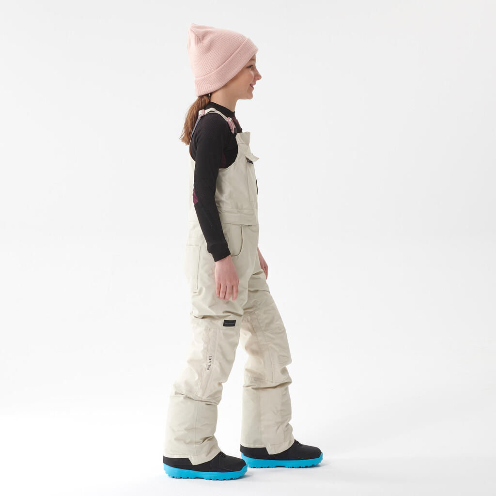 Detské nohavice Bib 500 s trakmi na snowboard a lyžovanie béžové