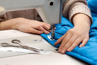 sewing machine repairing a jacket
