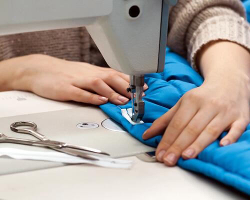 sewing machine repairing a jacket