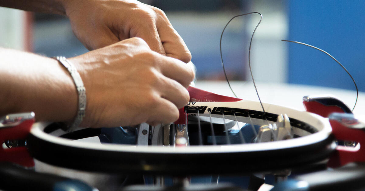 What is the correct string tension for a tennis racket?