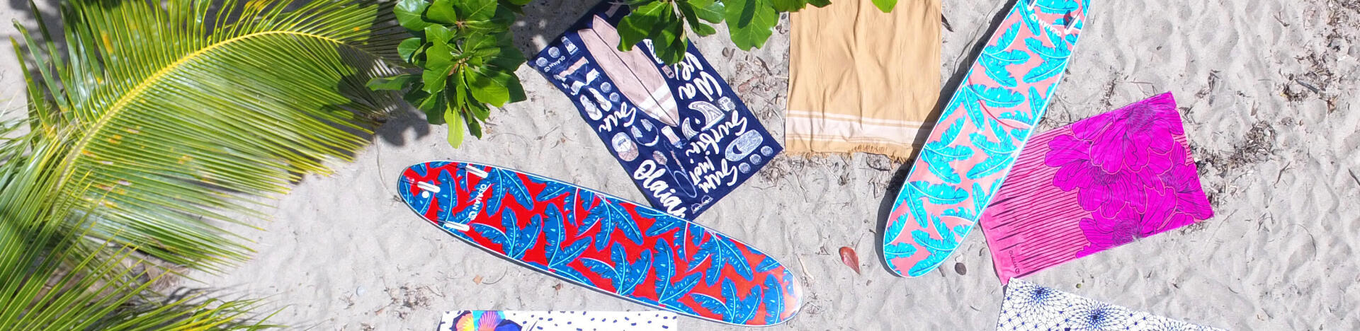 beach towels and surf boards on the beach