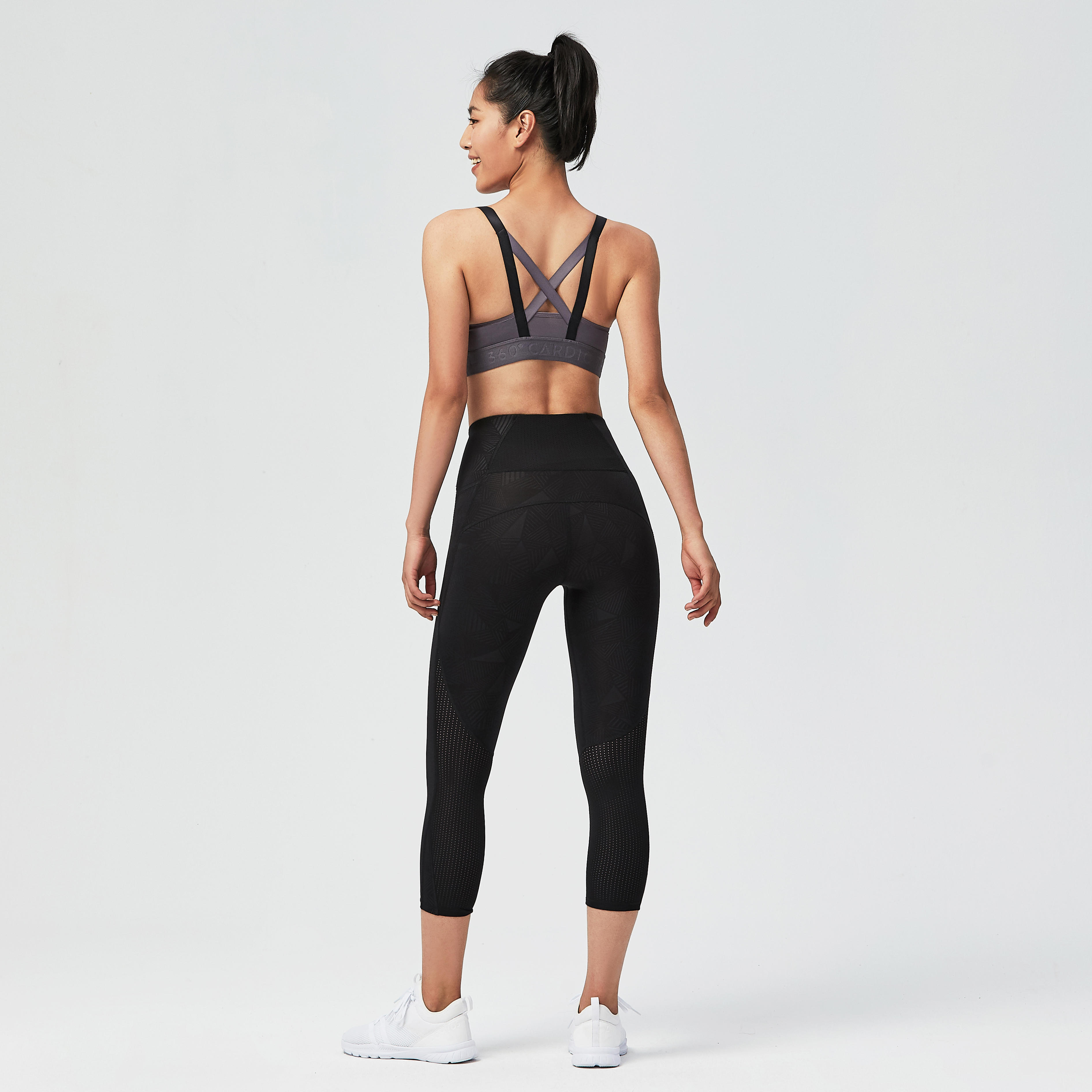 Full-length Side Portrait of the Young Athletic Woman in Black Short Top  and Gray Leggings Posing at White Background. Stock Photo - Image of  figure, leggings: 113618728