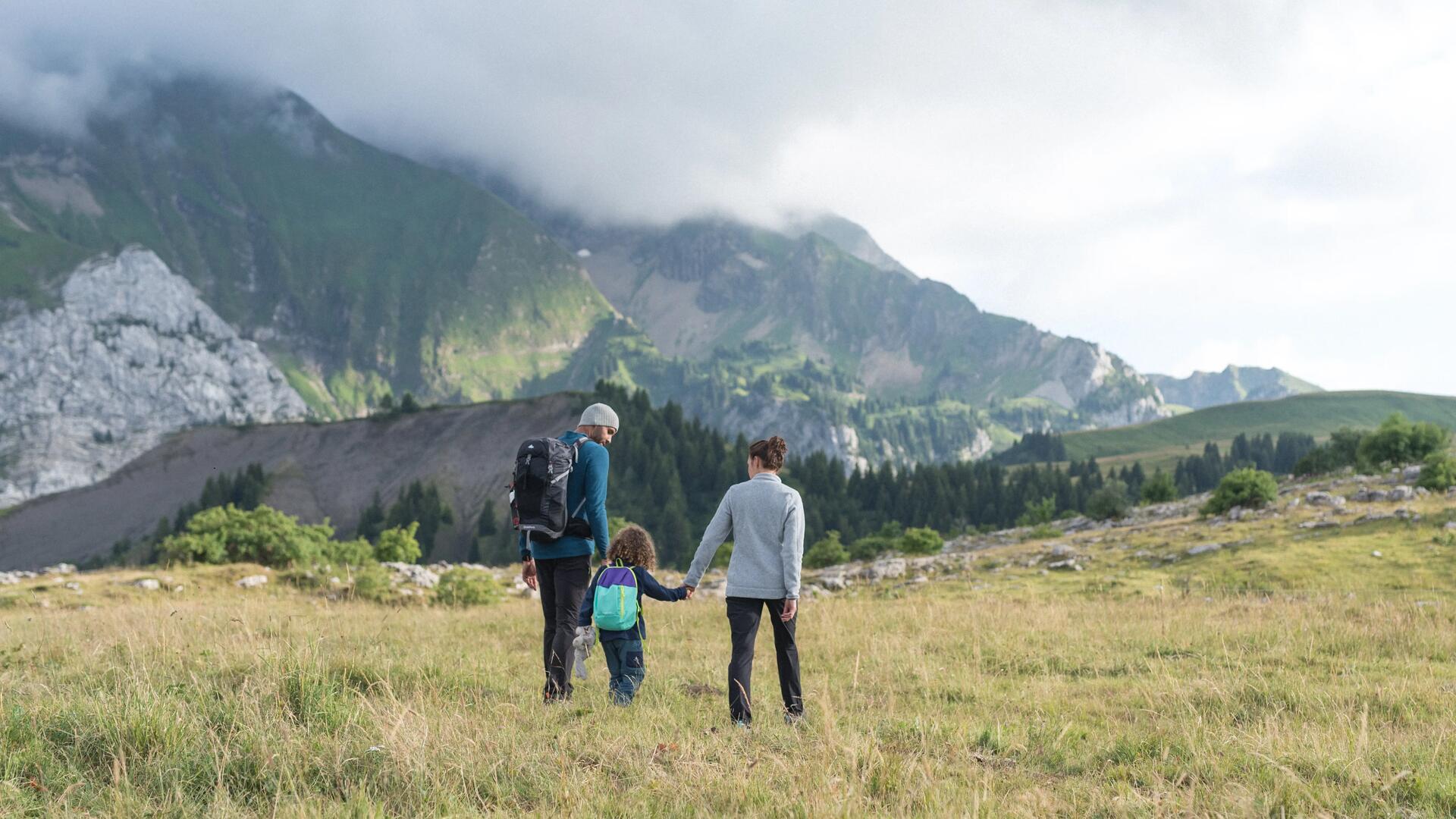 Picture of a couple with a kid in the mountains