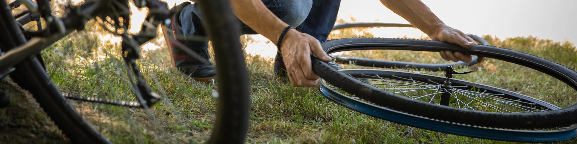 Man changing a bicycle inner tube
