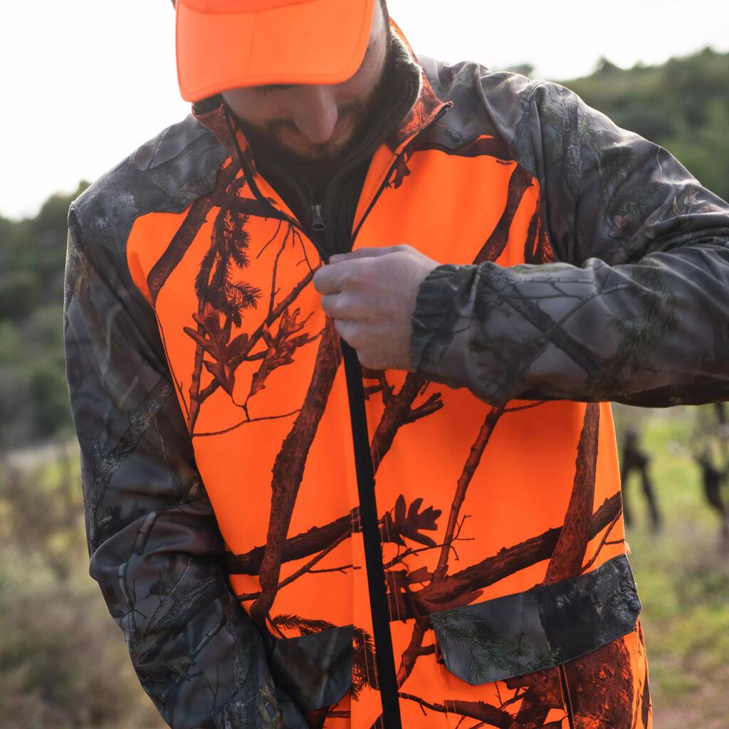 Poľovnícka bunda 100 na postriežku maskáčová fluorescenčná